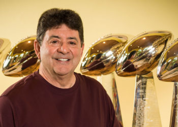 Tampa resident and San Fancisco 49's Hall of Fame Owner, Eddie Debartolo Jr. Posing in his trophy room with his five Lombardi Trophy's, awarded to the Super Bowl Champion.