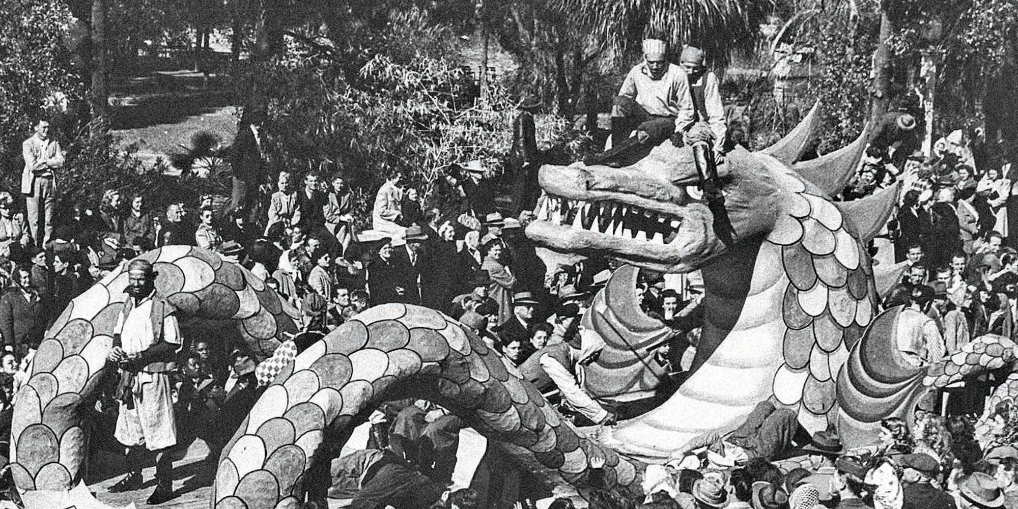 A dragon float makes its way through the parade in the late 1950s near Tampa Bay Hotel (University of Tampa). h. Several social events were part of the overall Gasparilla season. Pictured is a 1924 invitation to the annual Pirates Ball, one of the more important gatherings held before the invasion and parade. Photo courtesy of Tampa Bay History Center Collection