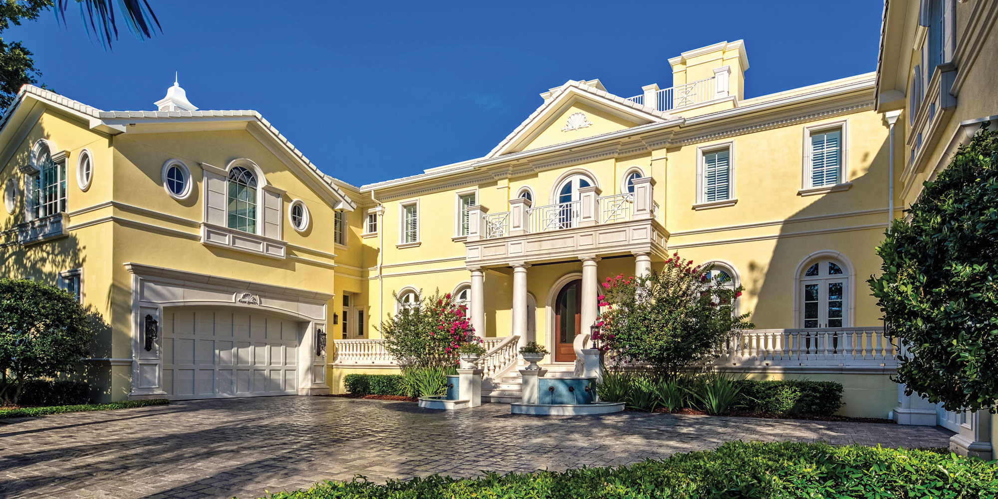 Spanning over 20,000 square feet, this Georgian-style mansion features 10 bedrooms, 15 bathrooms, five kitchens, seven fireplaces, a four-car garage and several covered balconies and loggias among three stories.